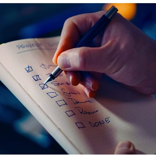 person completing a checklist